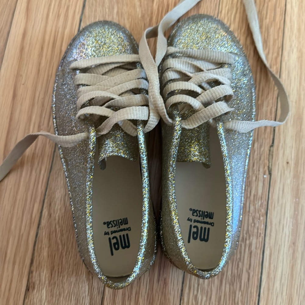 Gold glitter mini Melissa sneakers